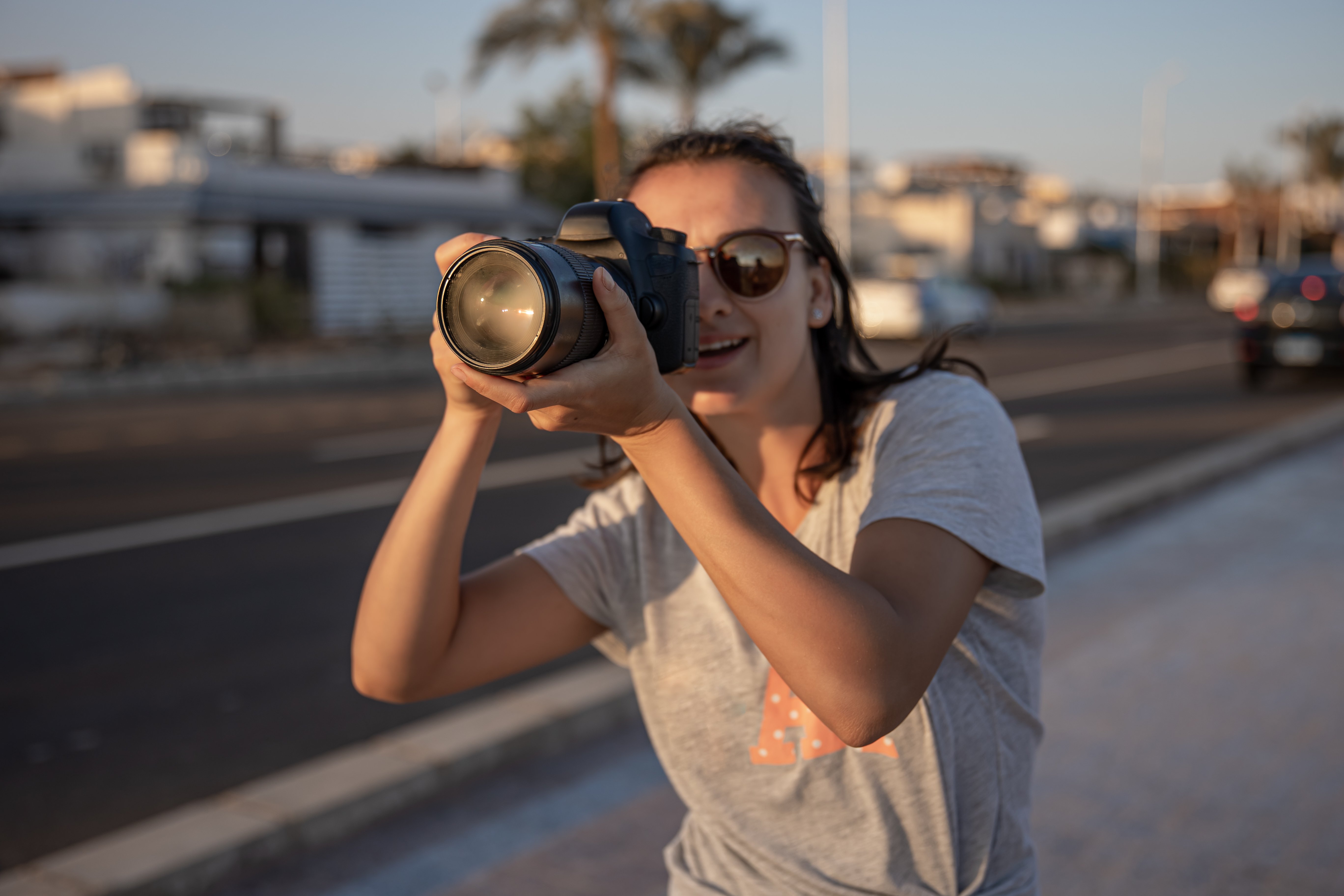 a-young-girl-in-sunglasses-with-a-professional-cam-2021-09-01-10-48-28-utc